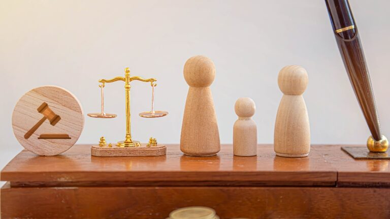 Figures of two parents and a child in between