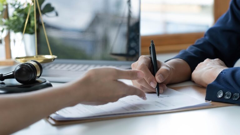 Person signing papers in private