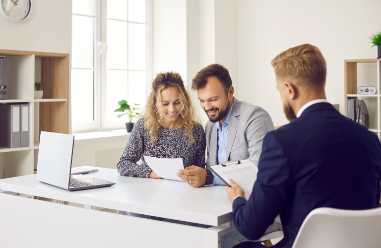 Happy clients speaking with lawyer